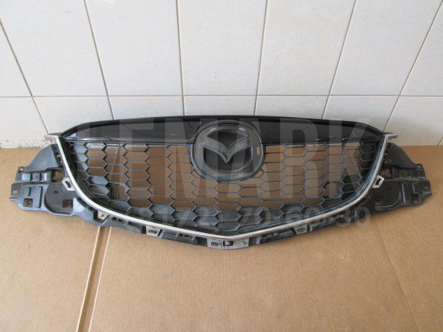Решетка радиатора Mazda CX 5 2012> KD4550710E